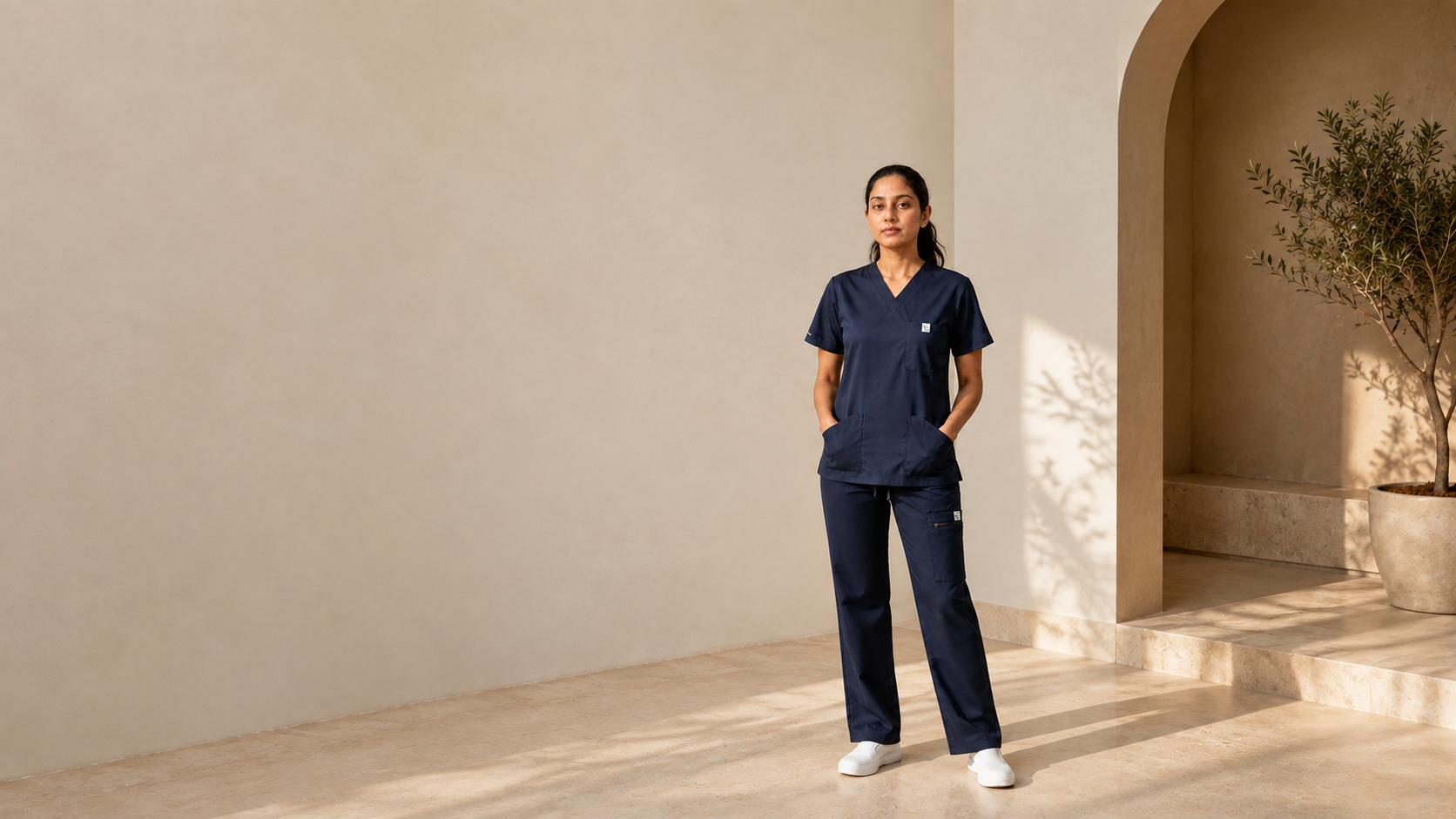 Aurum Flex premium navy scrub set in motion